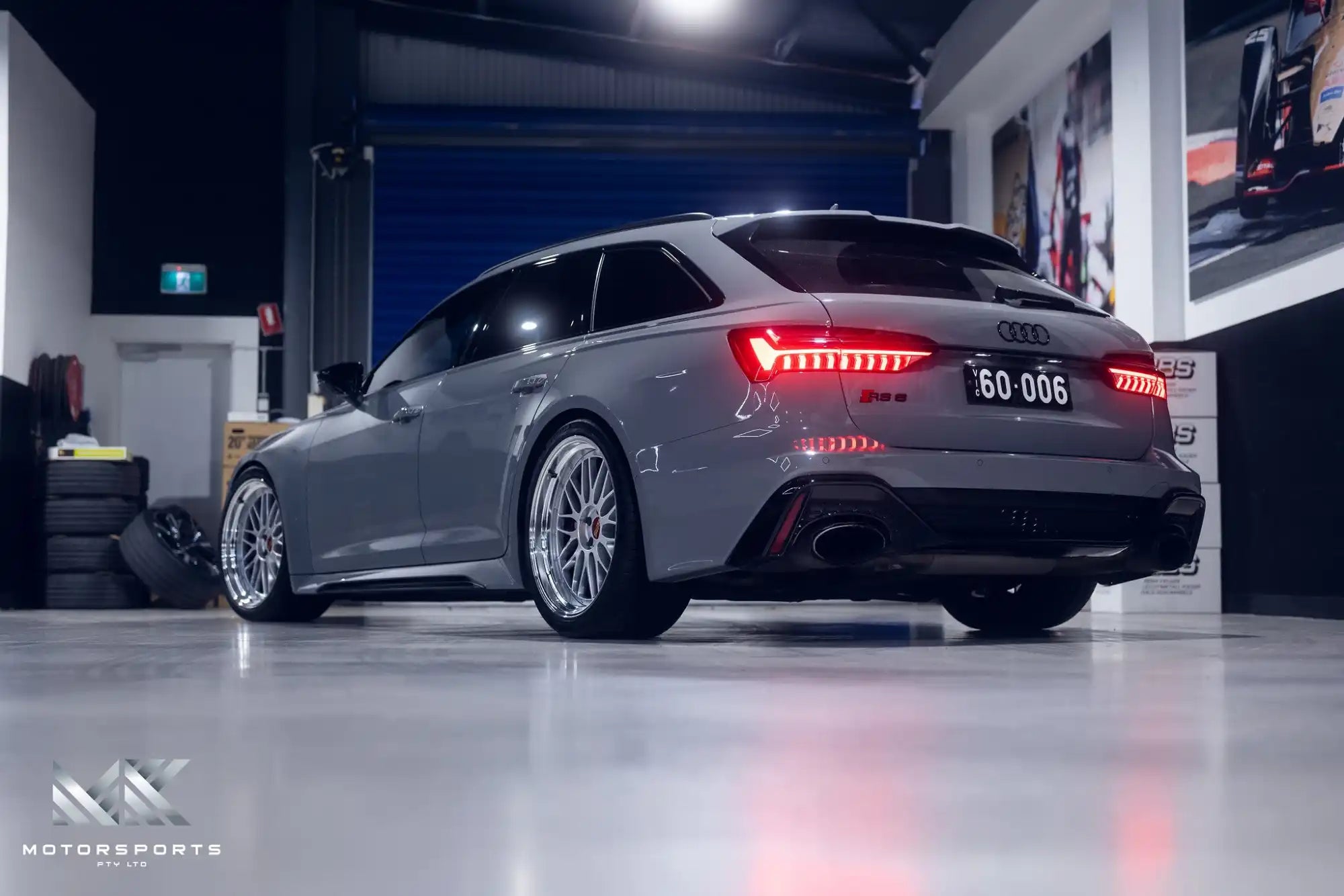 A gray Audi RS6 Avant with custom wheels.