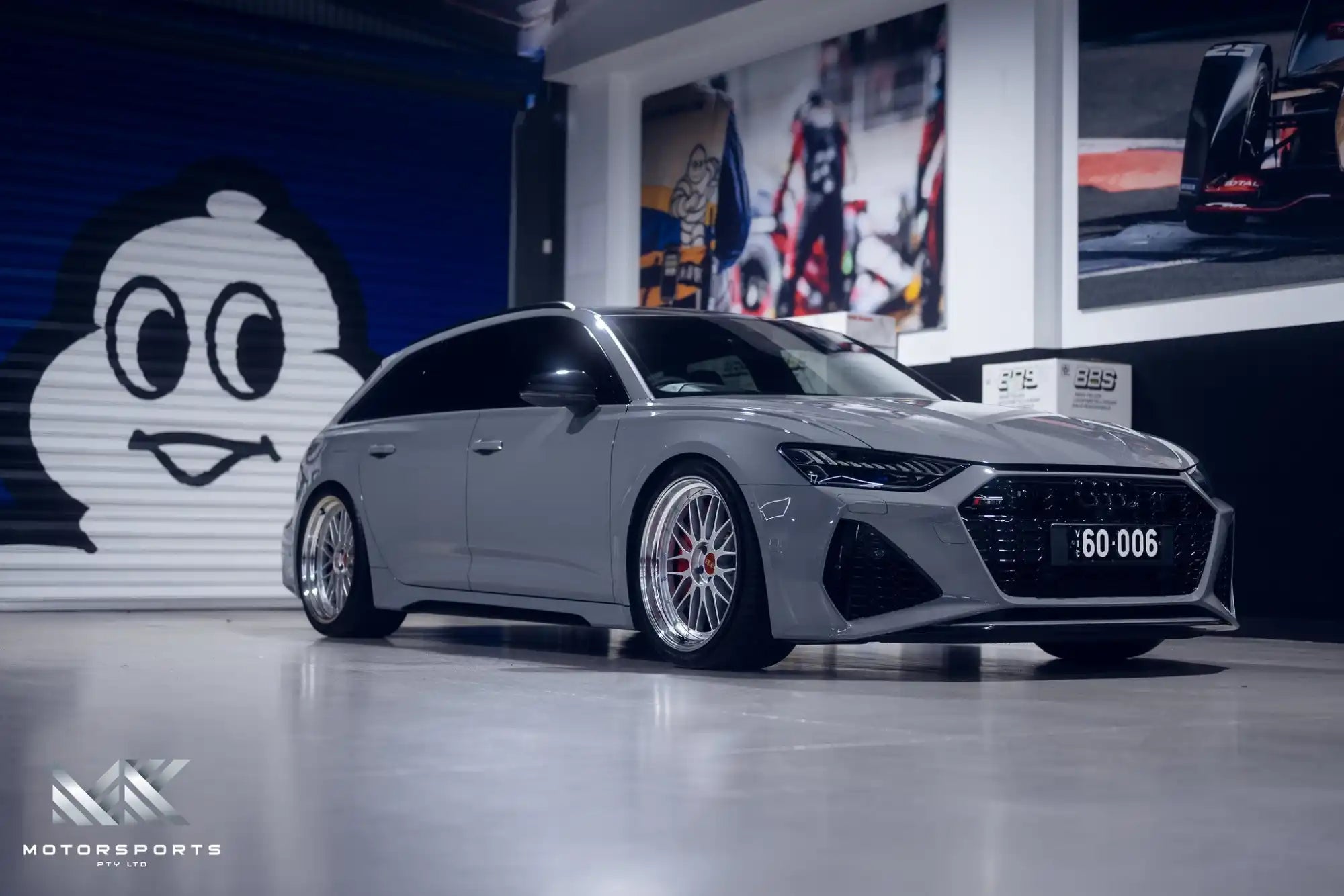 A sleek gray Audi station wagon with custom BBS wheels.