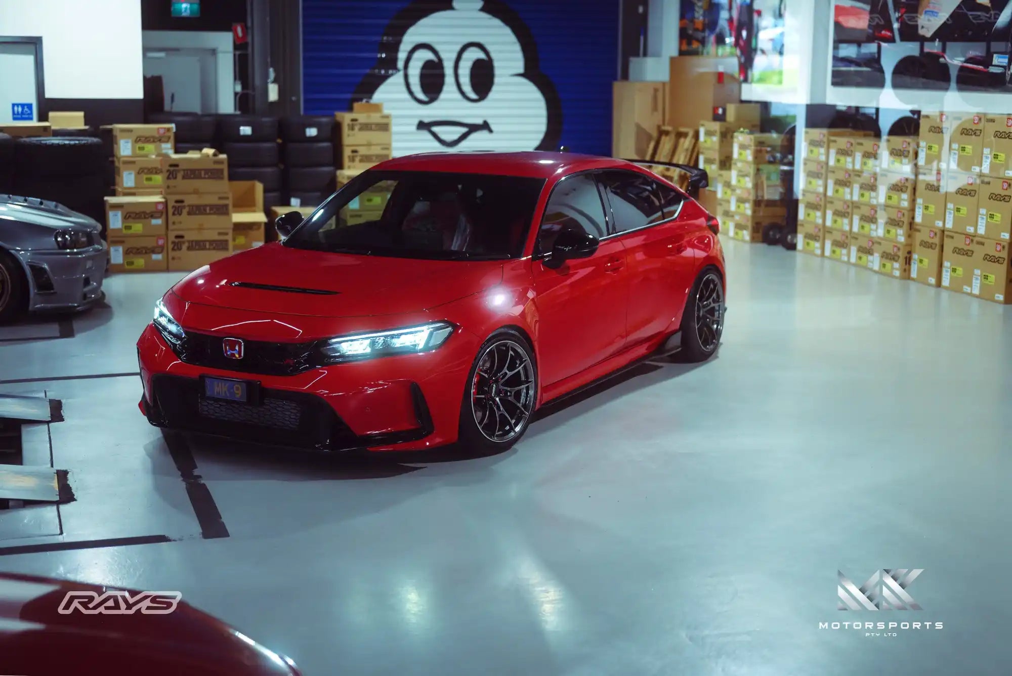 A vibrant red Honda Civic Type R, poised and ready for performance.
